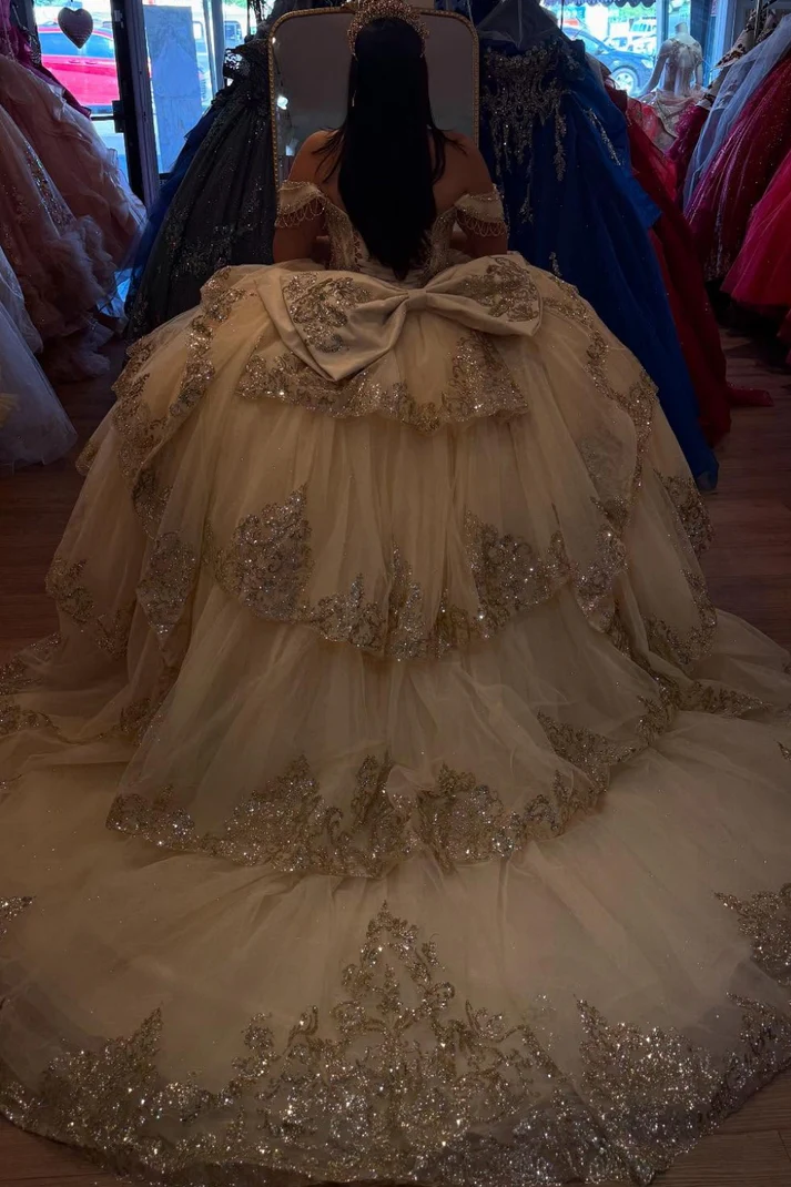 Off Shoulder Sleeveless Champagne Sweet 15 Quinceañera Dress with Beaded Appliques Ruffles Tiered Bow Knot